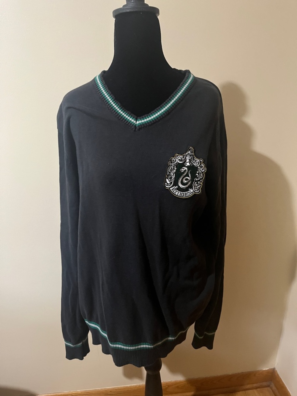 Black V-Neck Sweater with Green Trim and Crest Detail